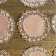 11 pink hand-lace coasters
