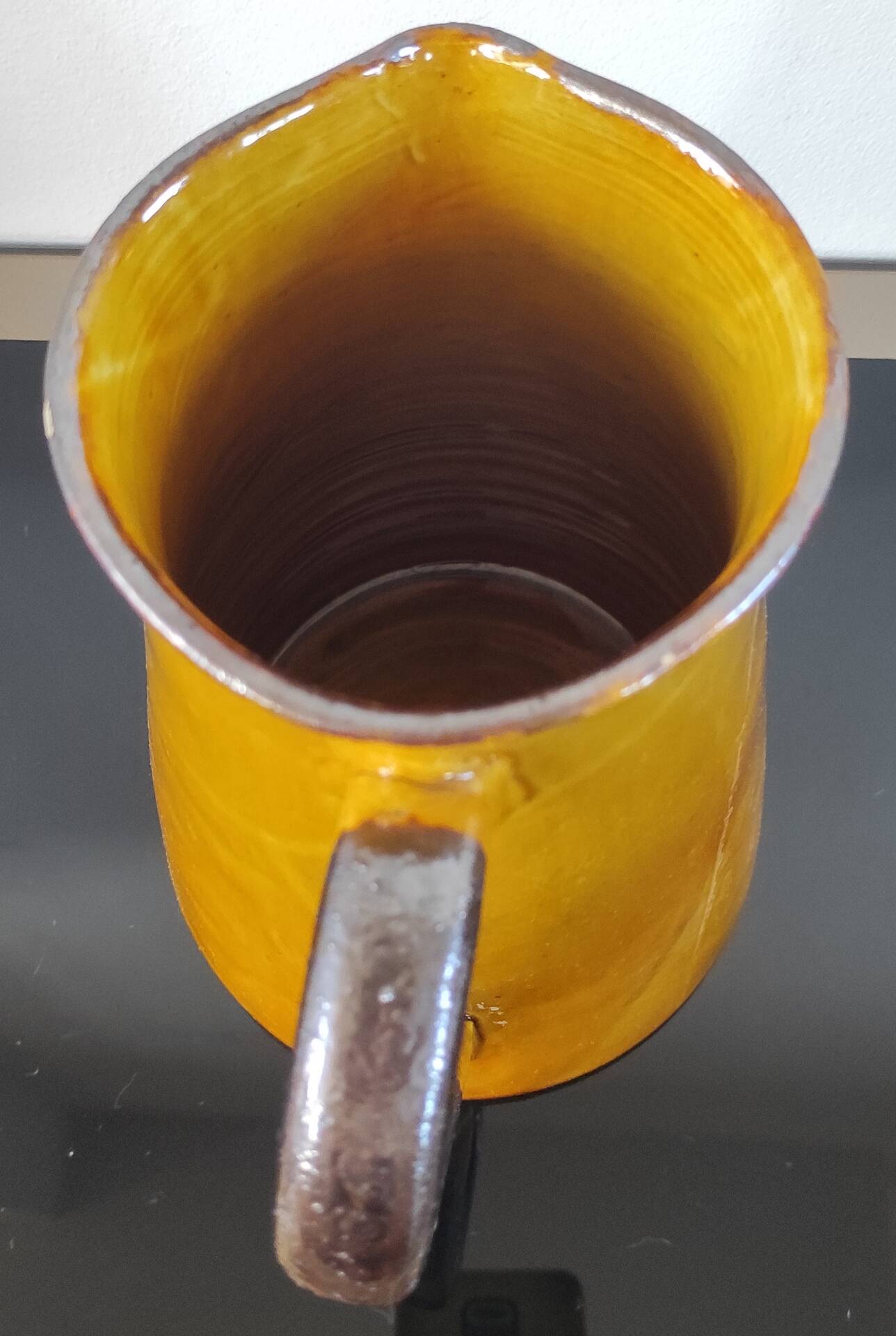 Vintage glazed terracotta pitcher