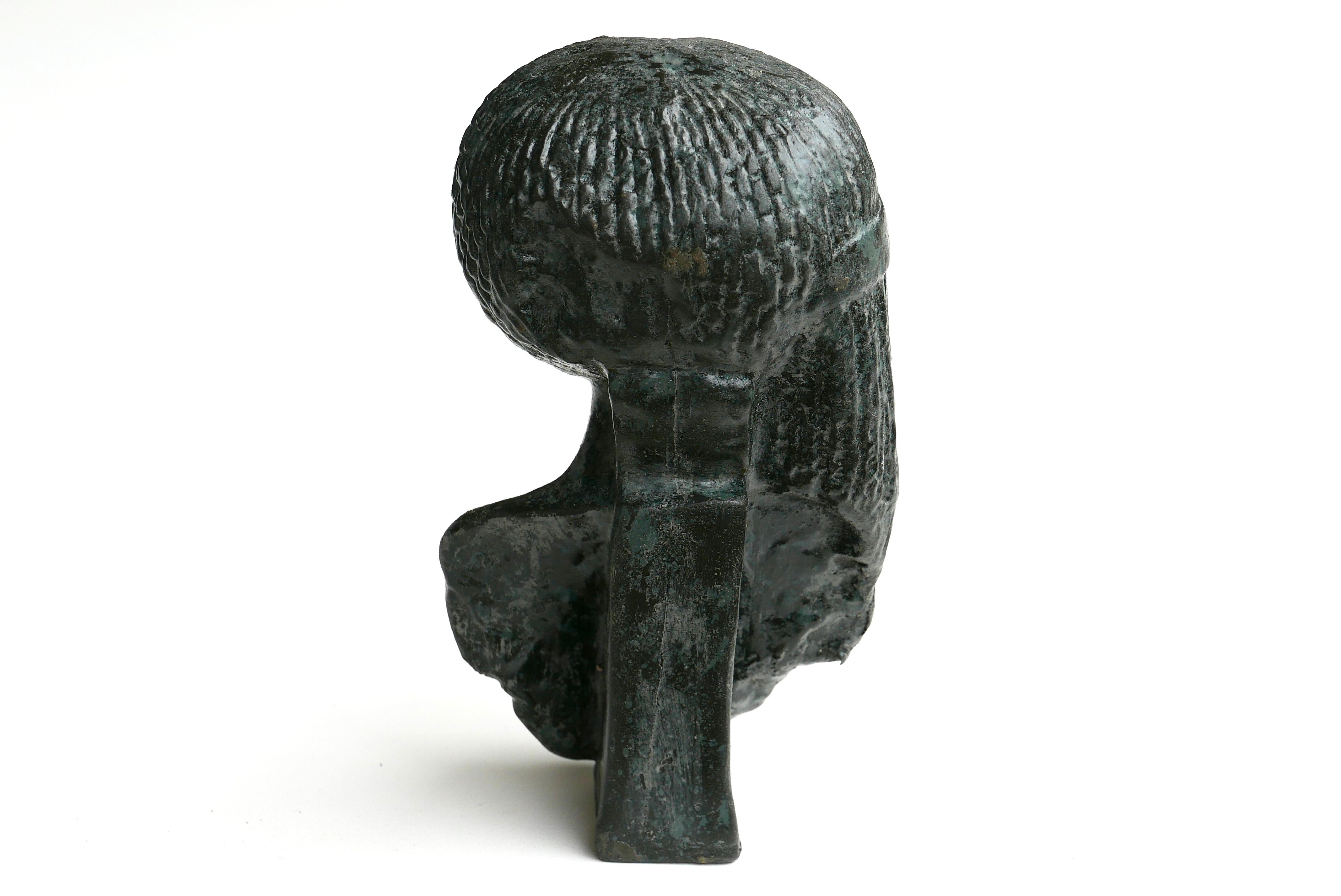 Woman bust in carved stone, 50s