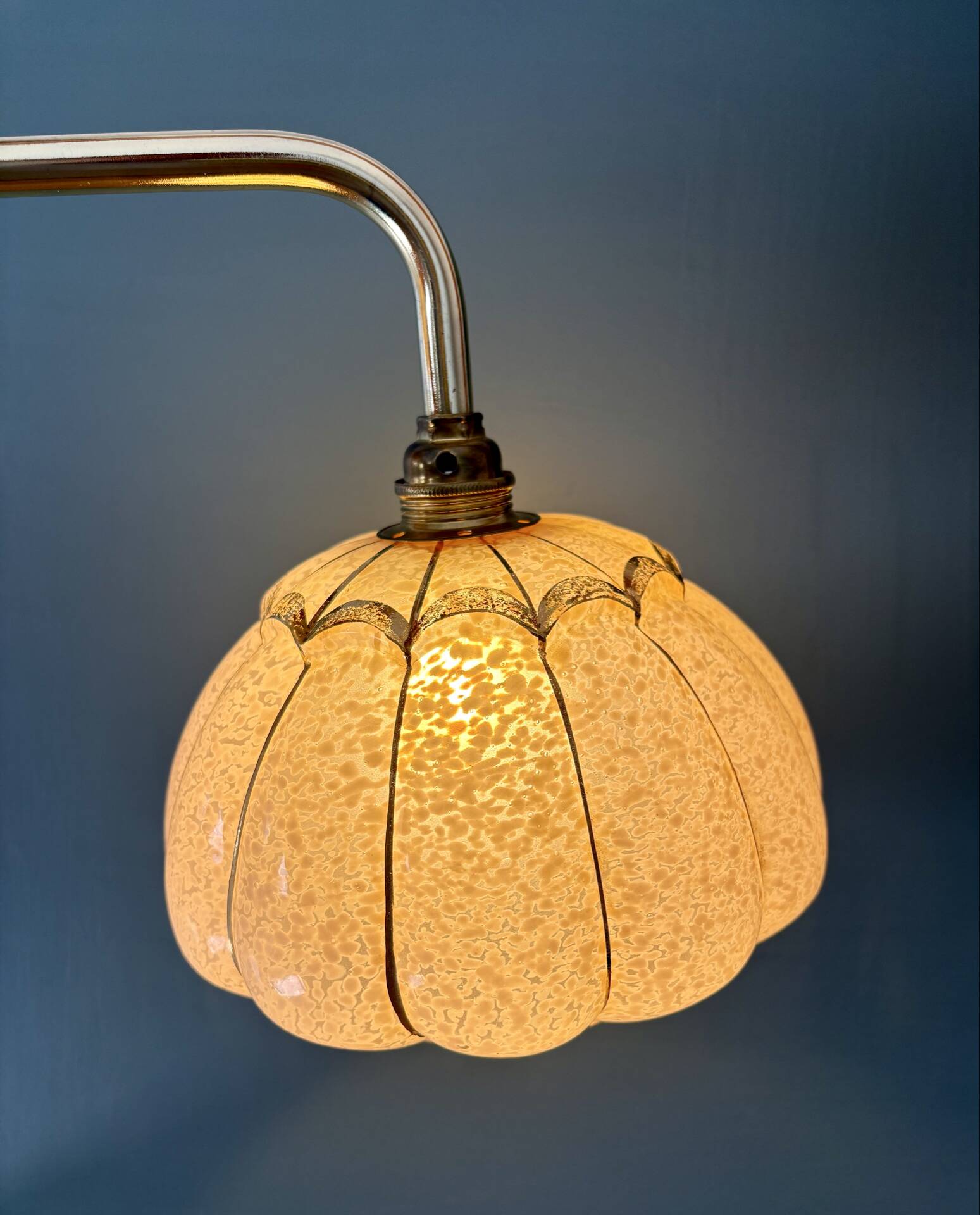 Vintage glass wall light with a pink and gold Clichy globe.