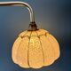 Vintage glass wall light with a pink and gold Clichy globe.