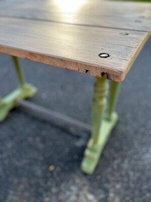 Old table with patinated green legs