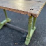 Old table with patinated green legs