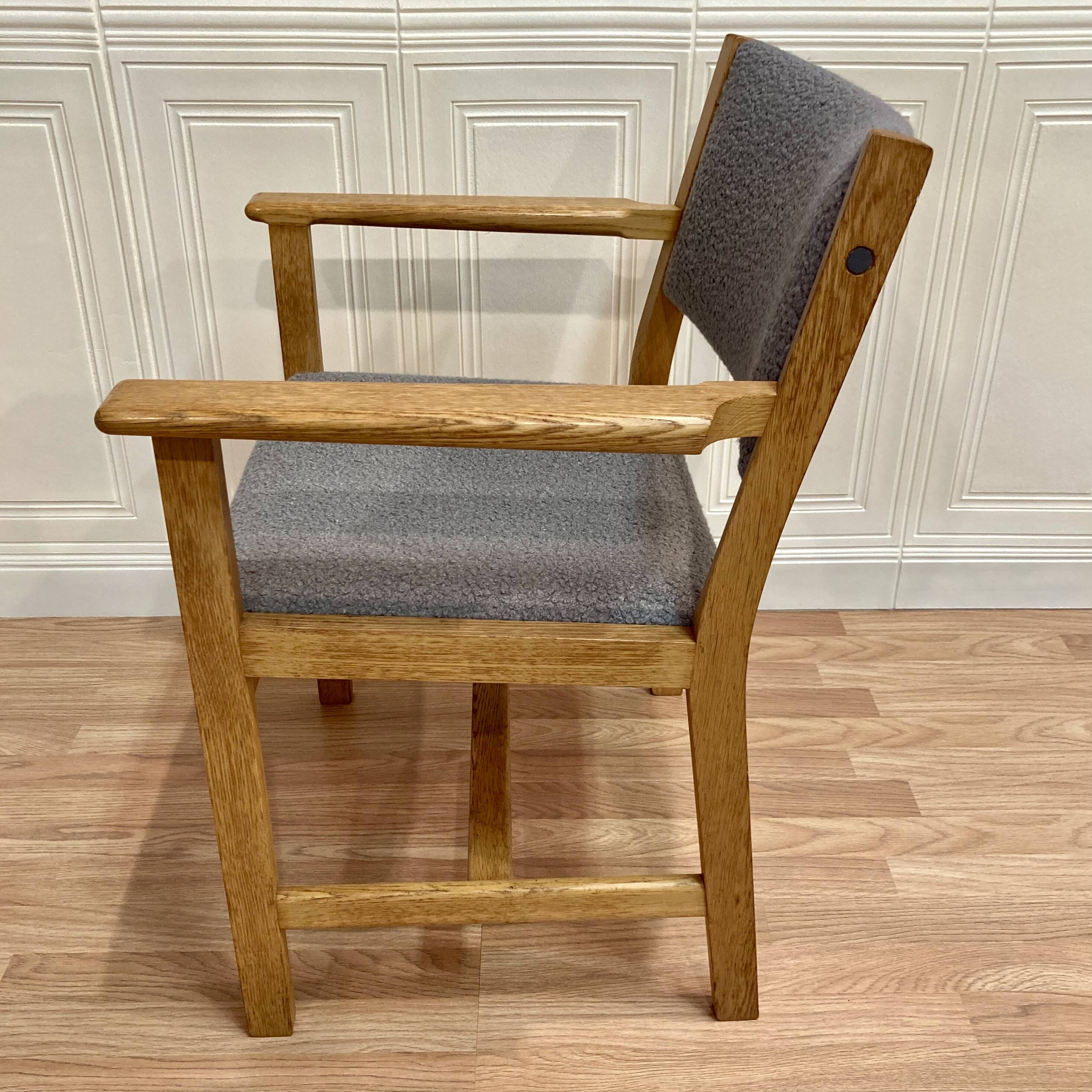 A pair of armchairs stamped "hans wegner" 1960.