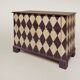 Pine chest of drawers from the 1940s with recent decorative paint.