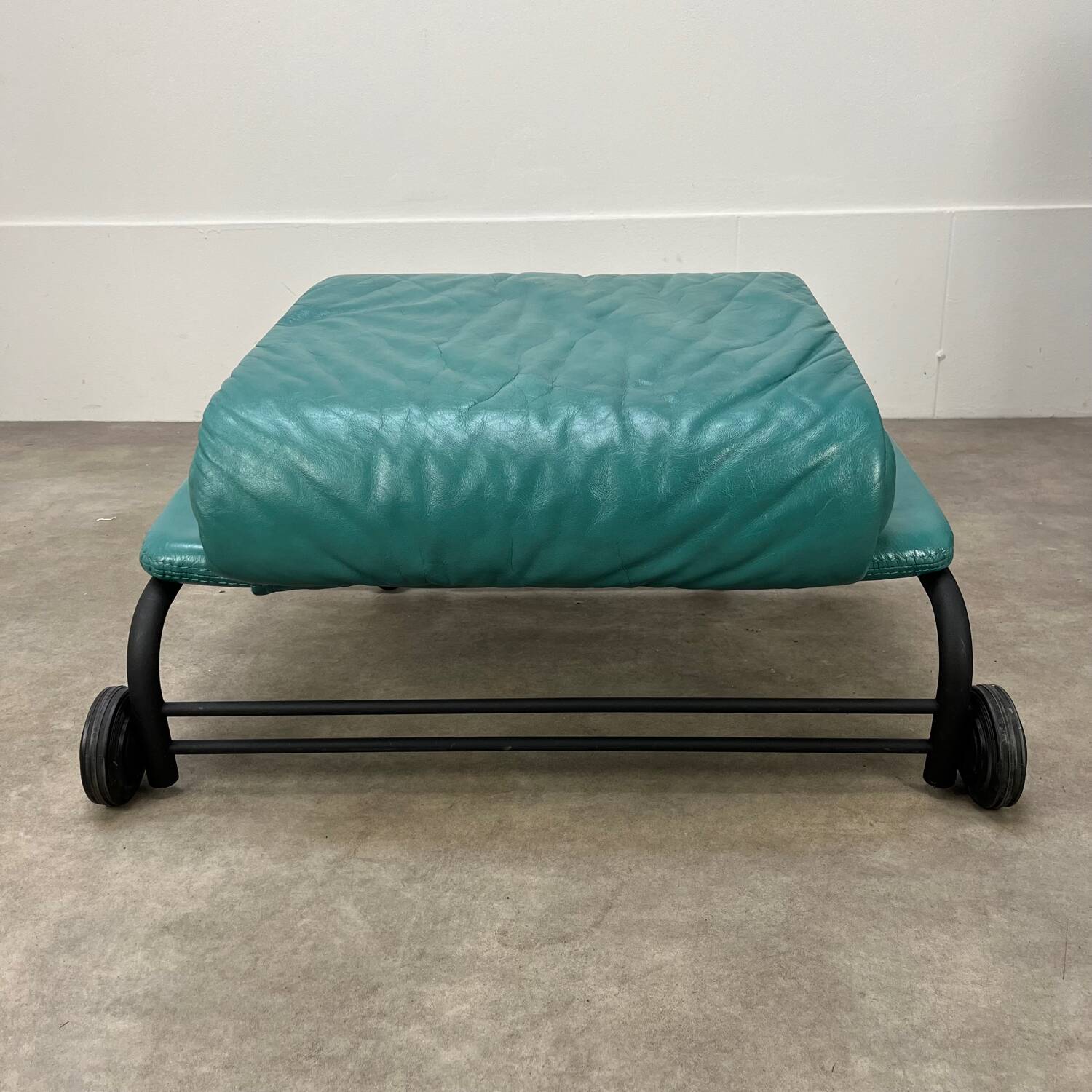 Postmodern design armchair and ottoman, 80s leather