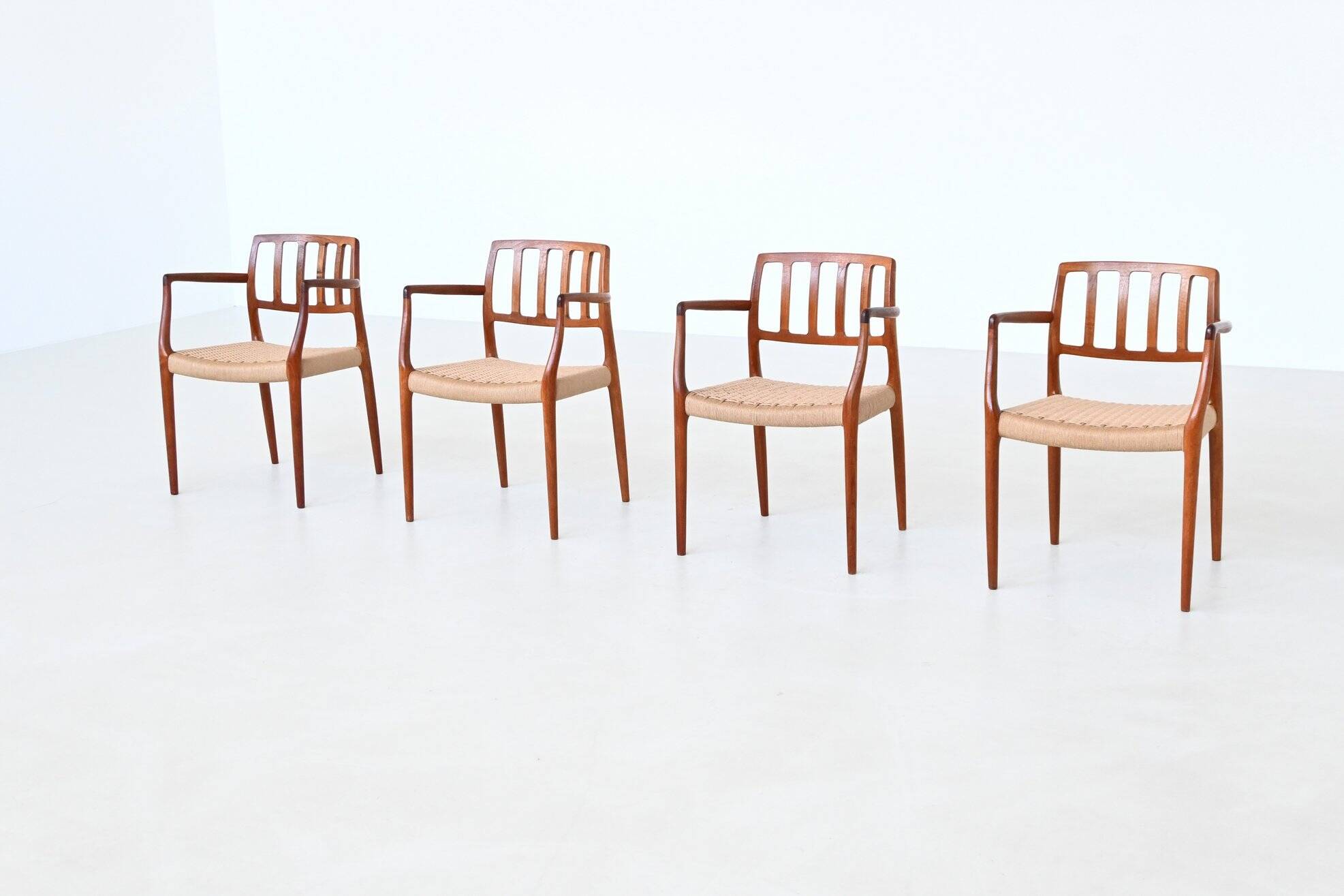 Niels Otto Moller model 66 armchairs teak and paper cord Denmark 1974