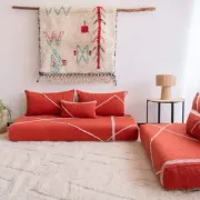 Handmade Moroccan floor cushion in orange cotton.