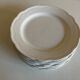 Set of 7 Mougins plates in white enamelled clay with gadroons