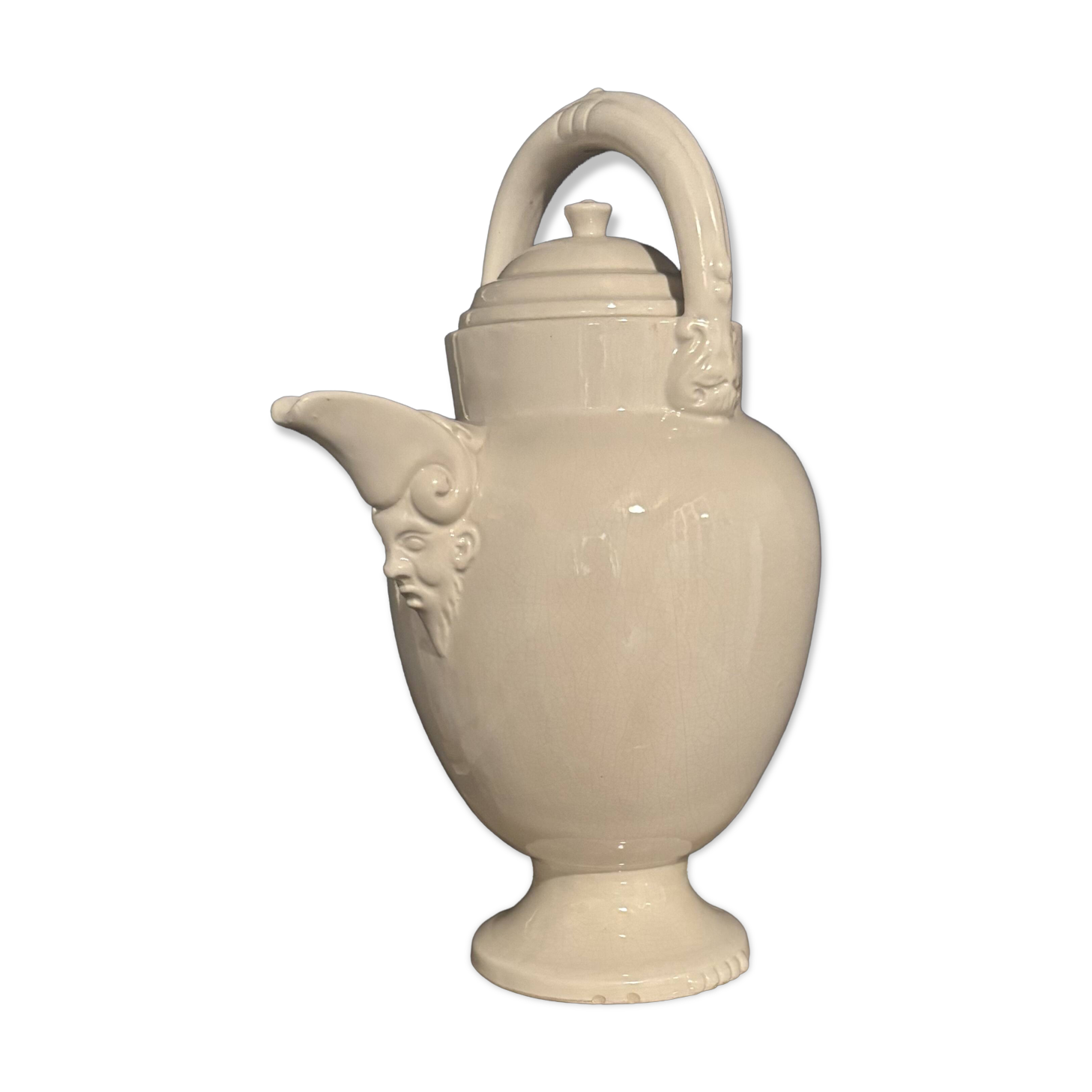 Large white faience jug with a satyr head spout, 19th century.