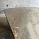 Light gray solid granite coffee table with organic triangular shape and conical base, 1980s