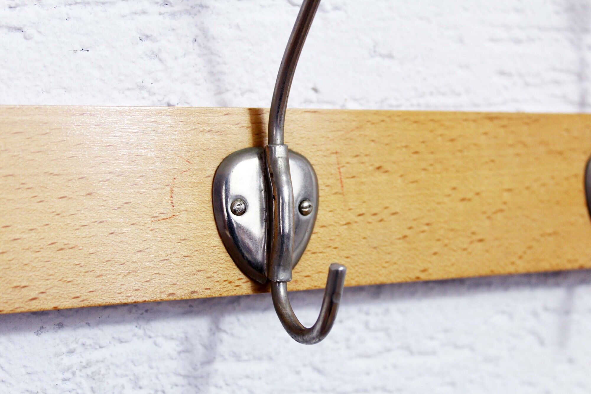 Peg wood and metal, wearing vintage coat
