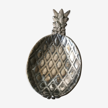 Empty silver metal pocket in pineapple shape