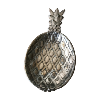 Empty silver metal pocket in pineapple shape