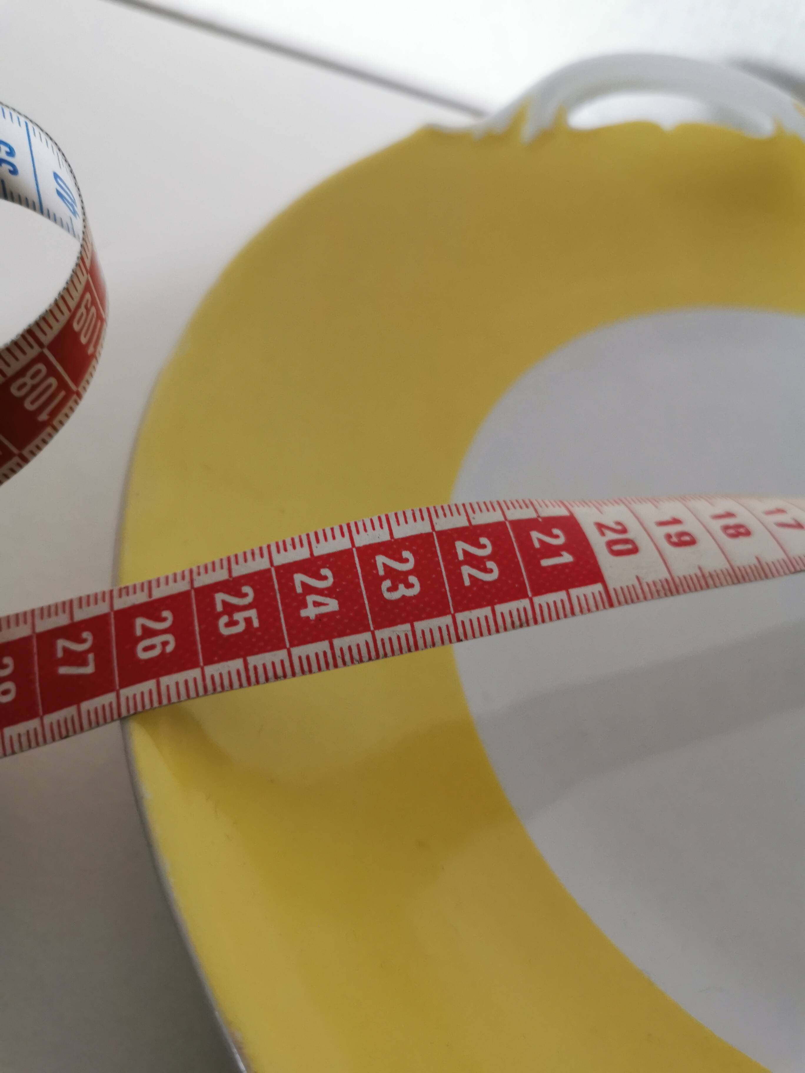 round yellow and white Limoges porcelain serving dish