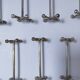 Eleven 70s design metal "crosshair" knife holders