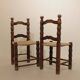 Pair of rustic chairs in turned wood with straw seats