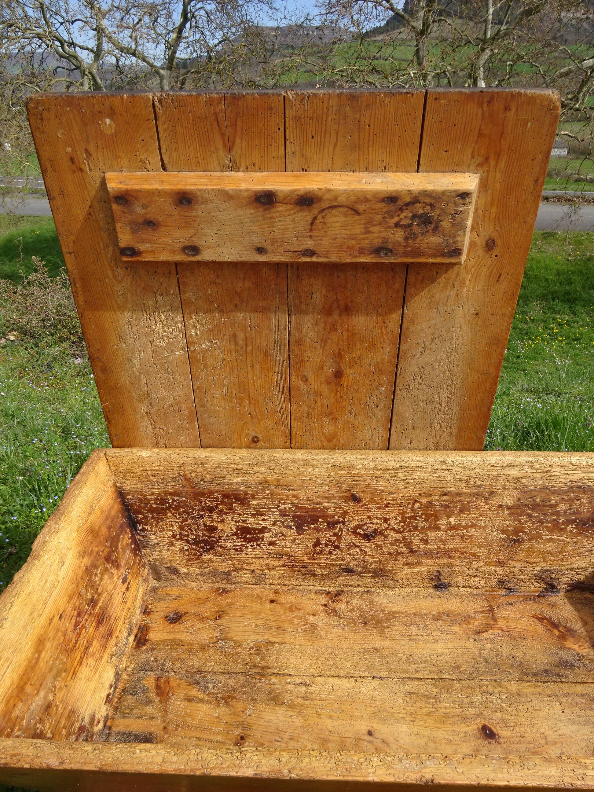 Very old solid oak dough trough with a lid and removable legs.