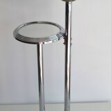 Ashtray and shelf on chrome metal stand.