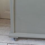 Toy chest on wheels patinated green of gray