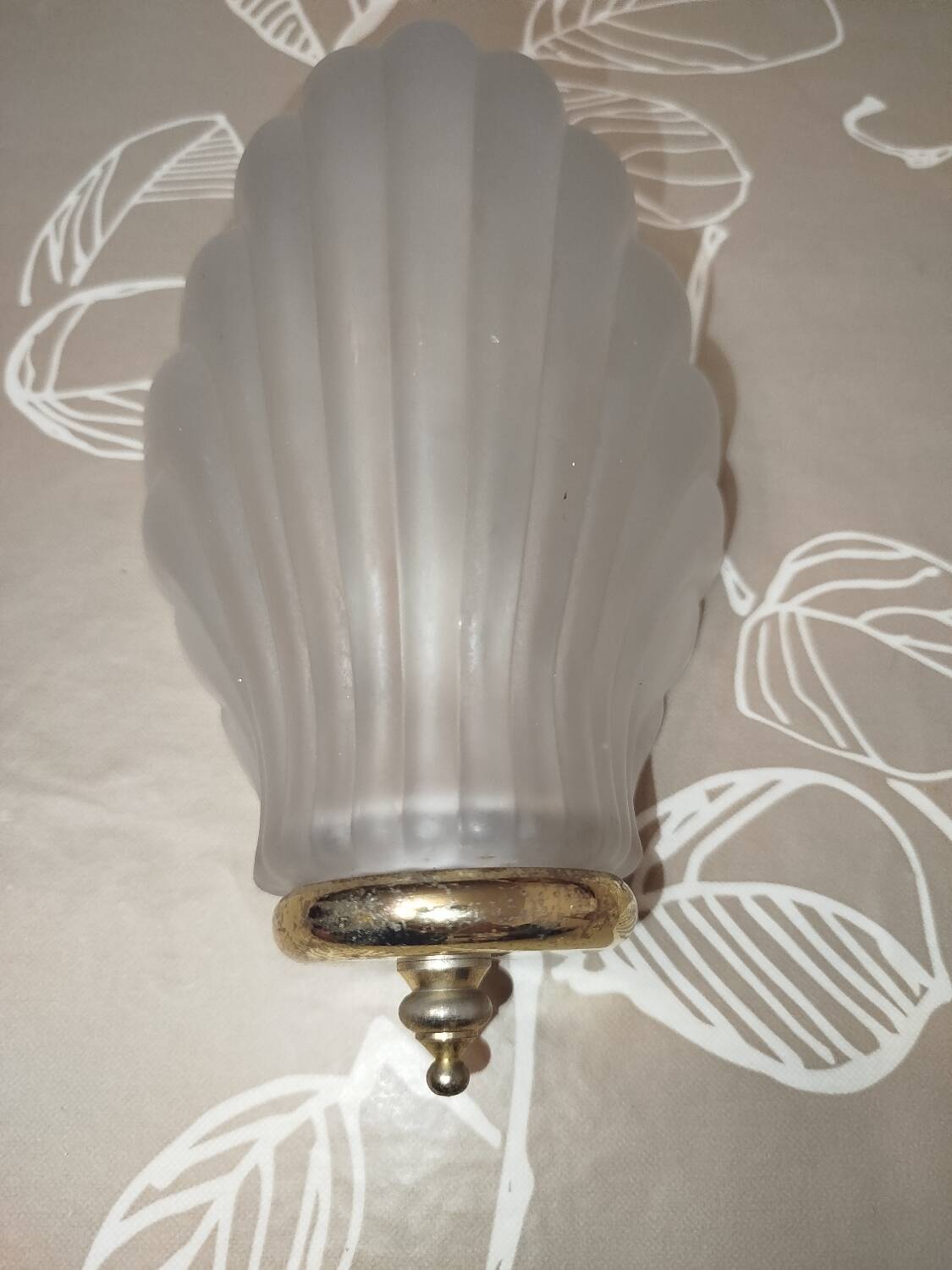 Art Deco wall sconces in frosted glass with a seashell design