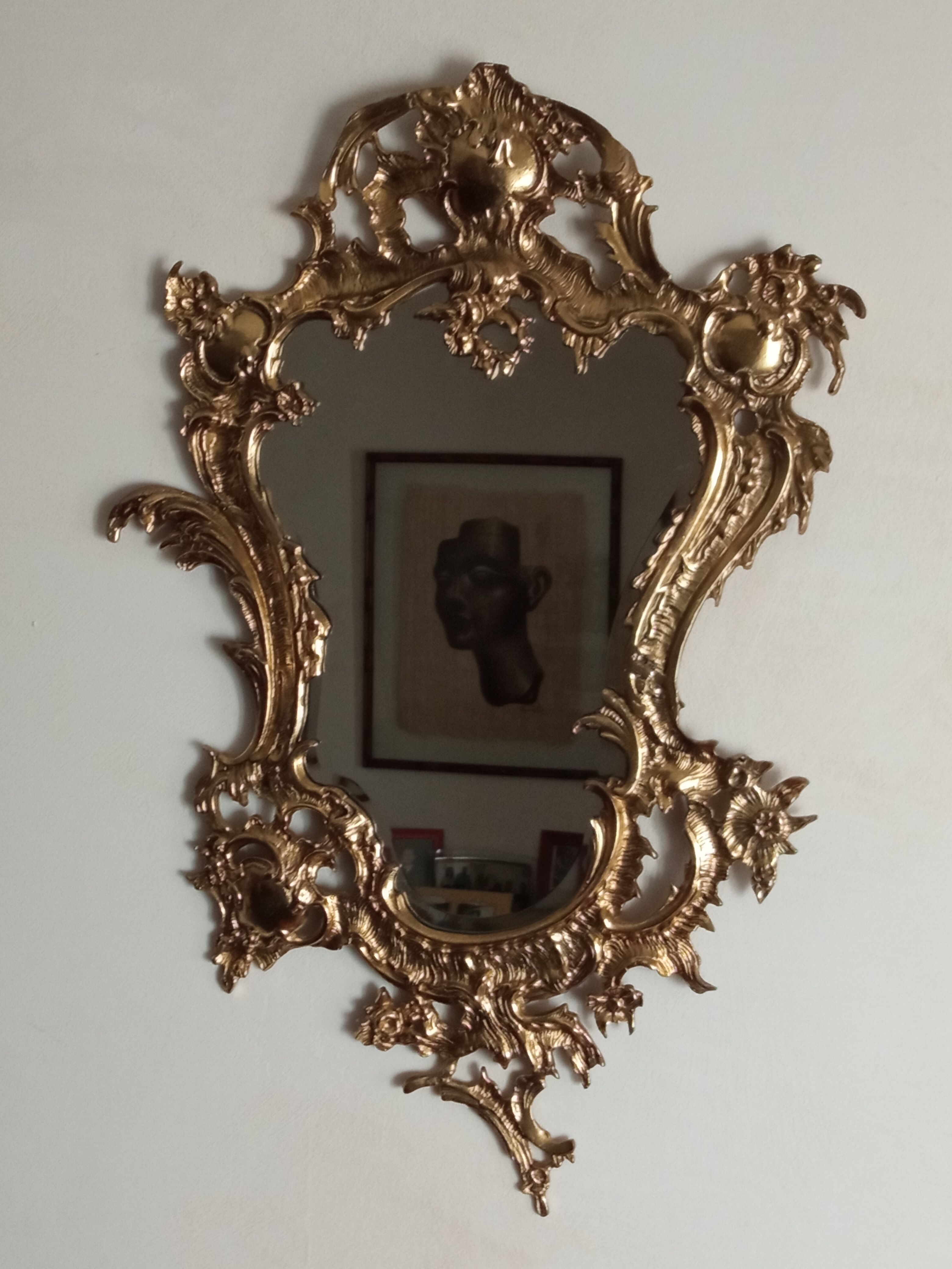 Antique mirror in gilded metal