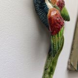 Two exotic birds in slip to hang
