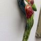 Two exotic birds in slip to hang