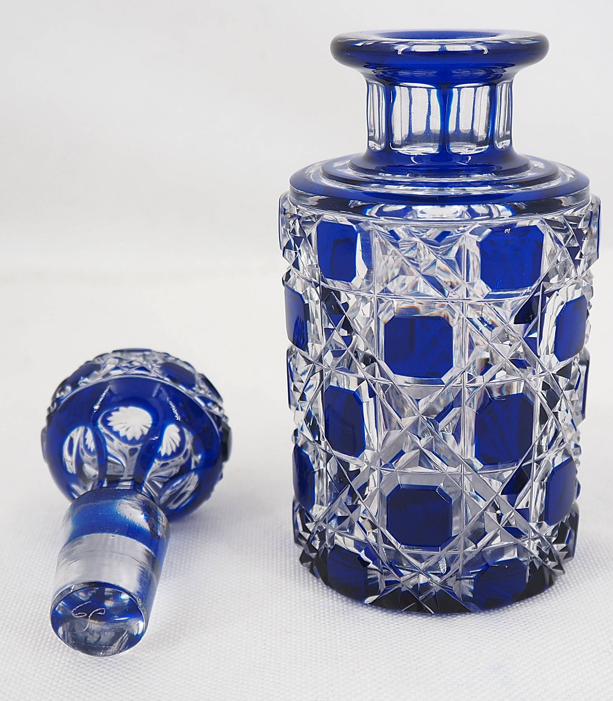 Baccarat, cut crystal bottle, blue lined, diamond gemstones, 14.8 cm.