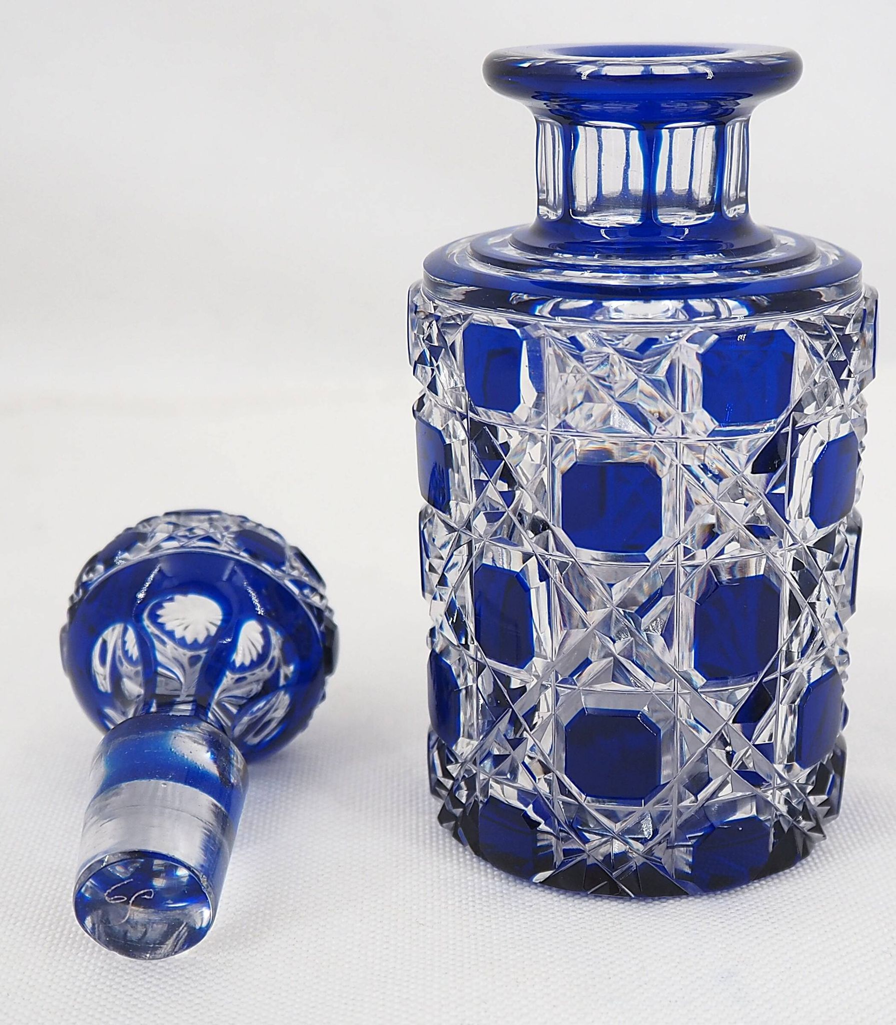 Baccarat, cut crystal bottle, blue lined, diamond gemstones, 14.8 cm.