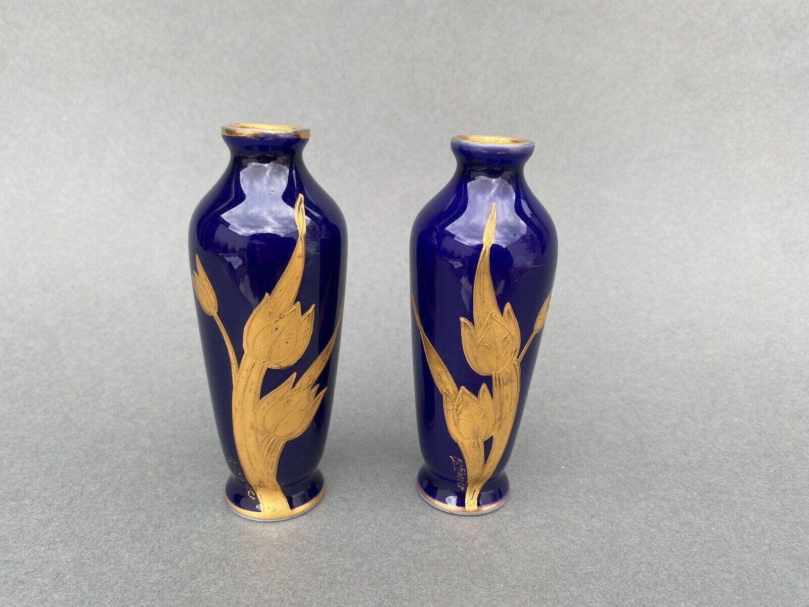 Pair of 1900 Limoges vases with blue background and gold highlights, R. Rosier decorations