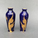 Pair of 1900 Limoges vases with blue background and gold highlights, R. Rosier decorations