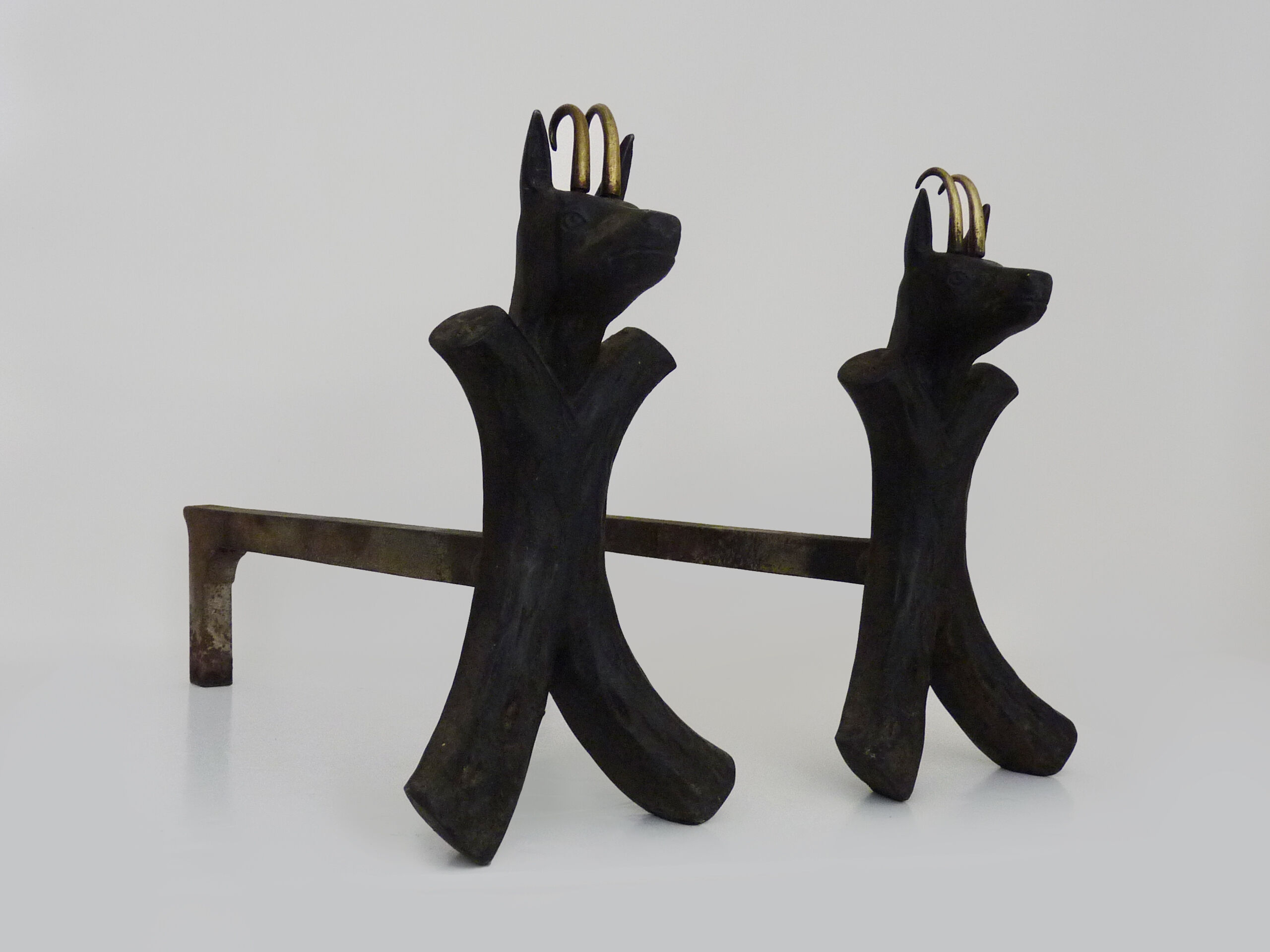 Pair of zoomorphic cast iron chimney pegs representing Isards. 50s