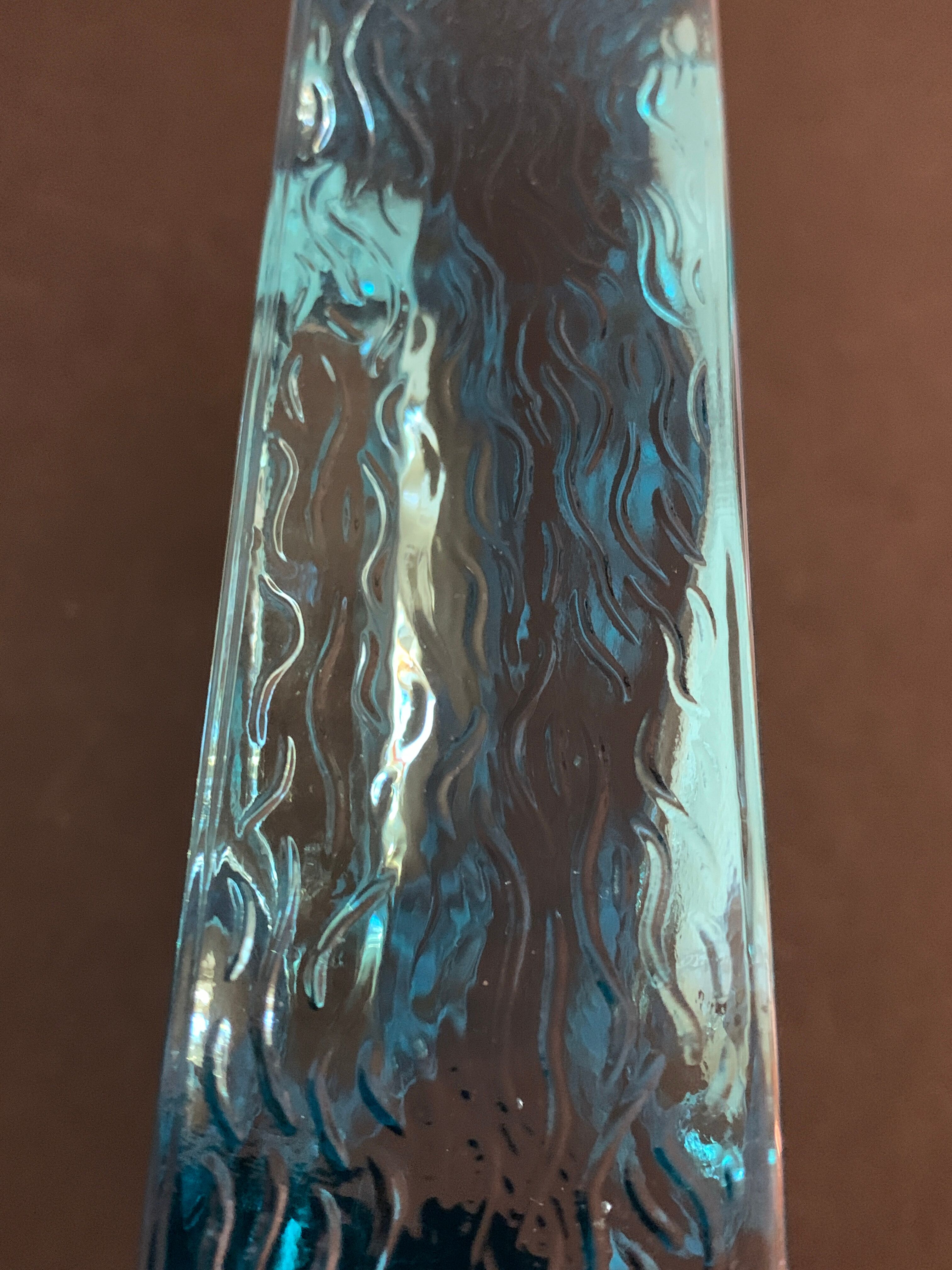 Ashtray paved in blue glass