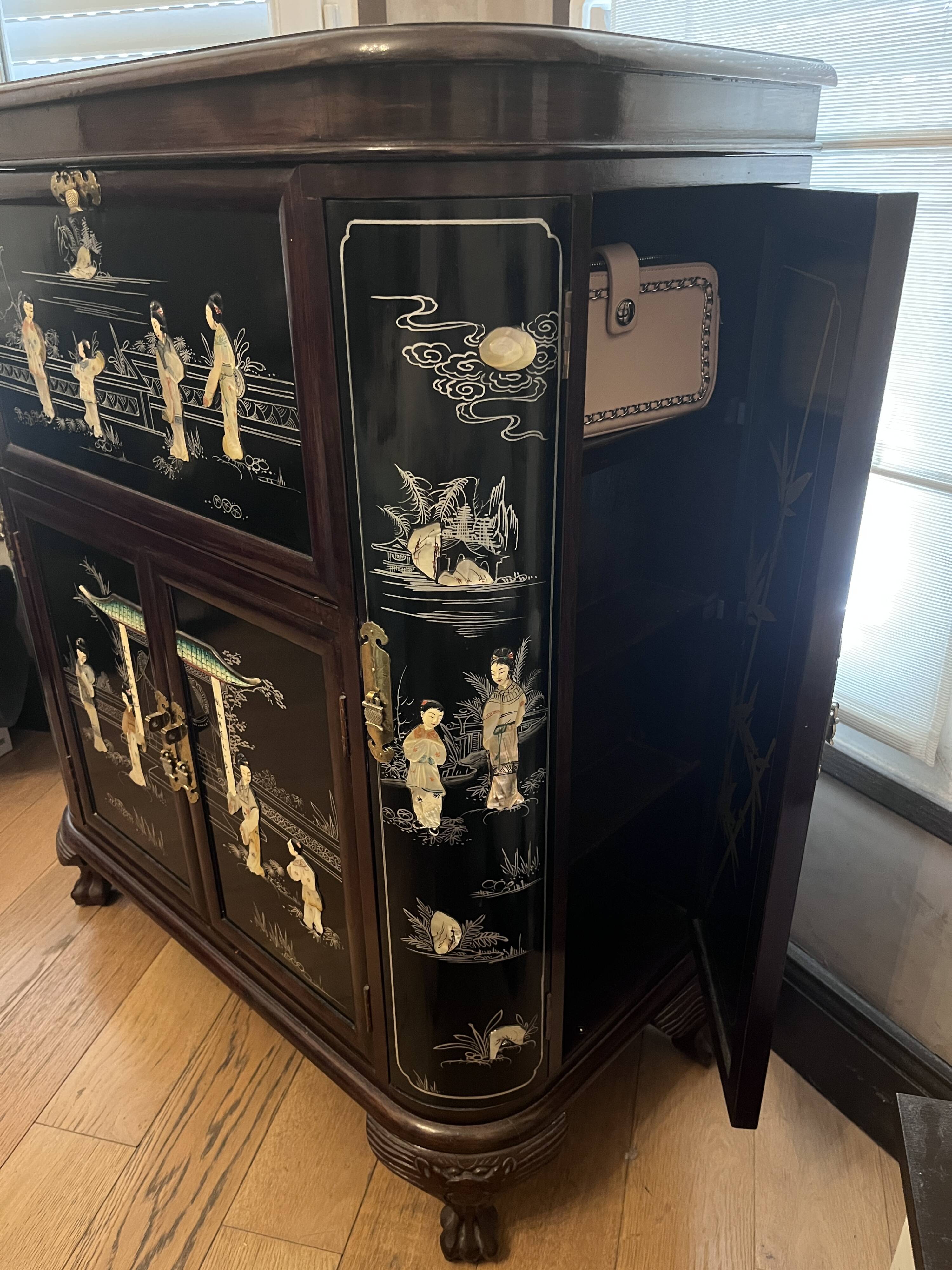 "Chinese black lacquer cabinet, mother-of-pearl inlays, court scenes"