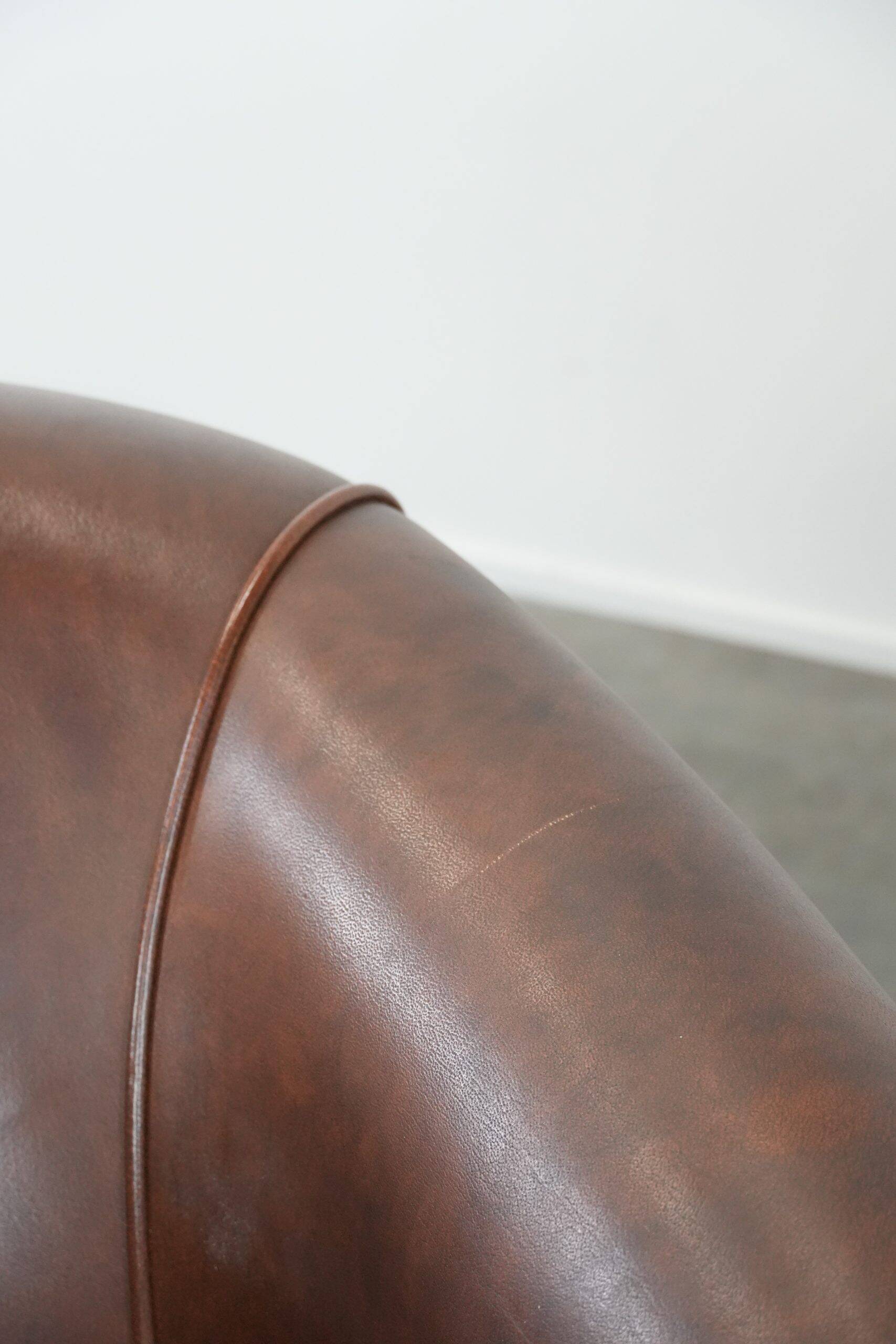 Unique set of two cognac-coloured cow leather club armchairs