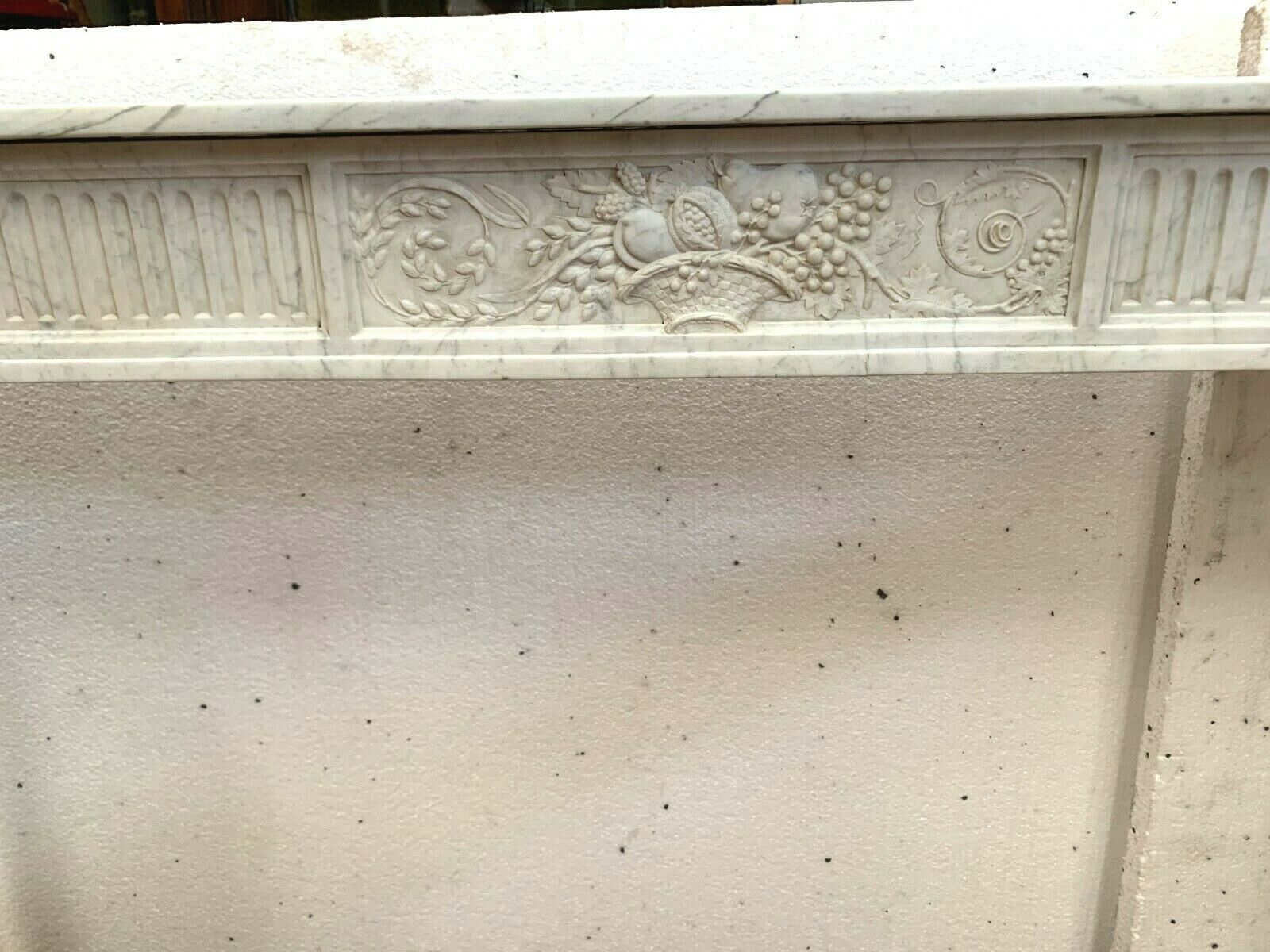 Louis XVI fireplace in 19th century white Carrara marble