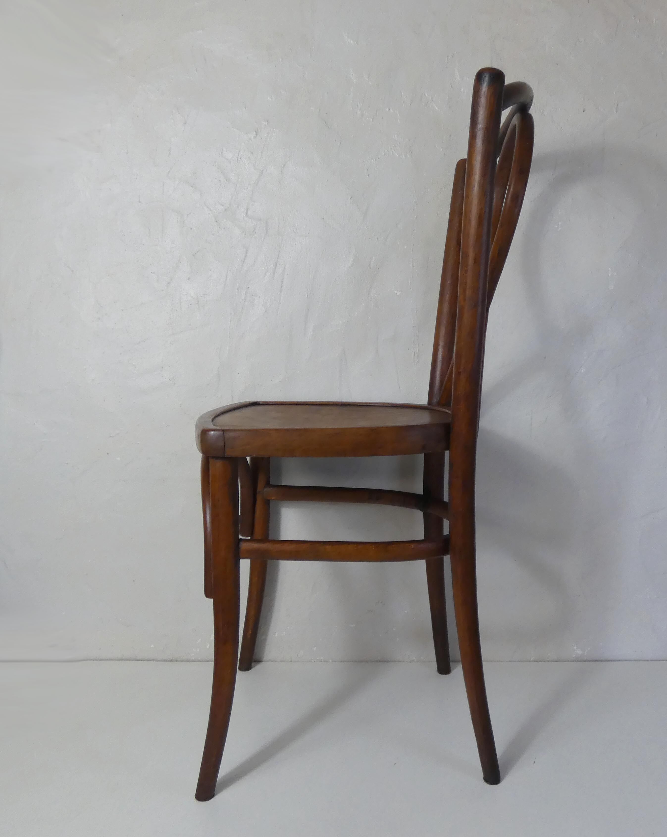 Old curved wooden bistro chair