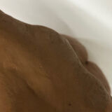 School bust of a female body in red clay terracotta