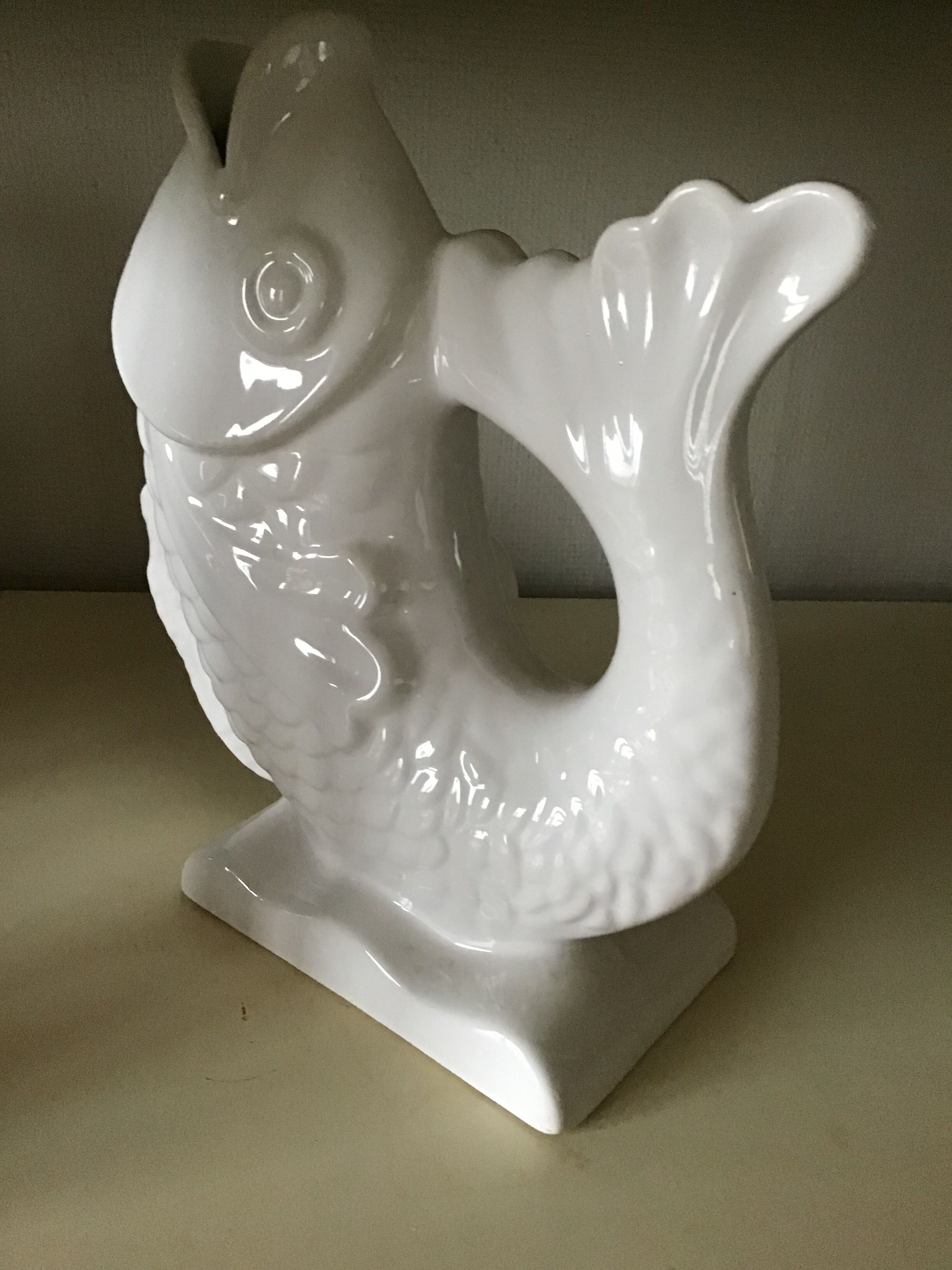 White ceramic vase in the shape of fish