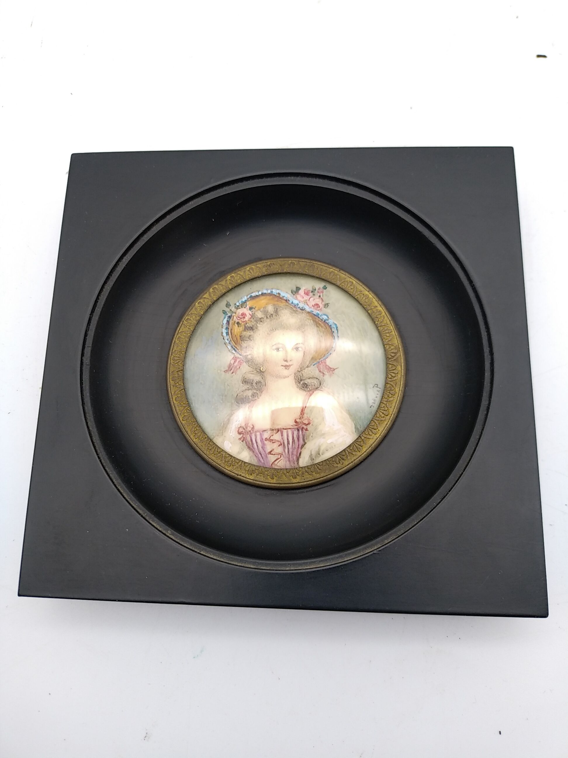 Miniature on ivory. Young woman with a flowery hat