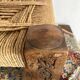 Low stool with carved wood and braided cord.