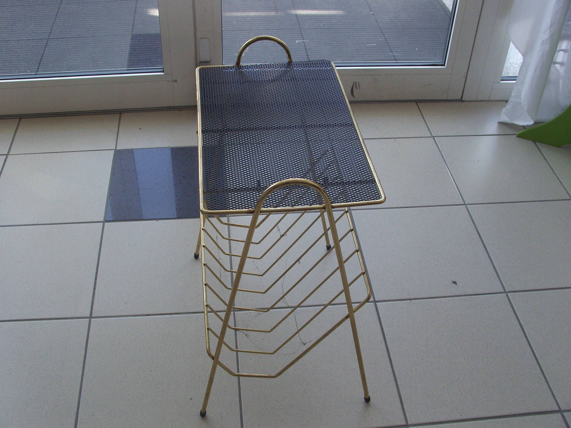 Vintage magazine door in gold metal and open