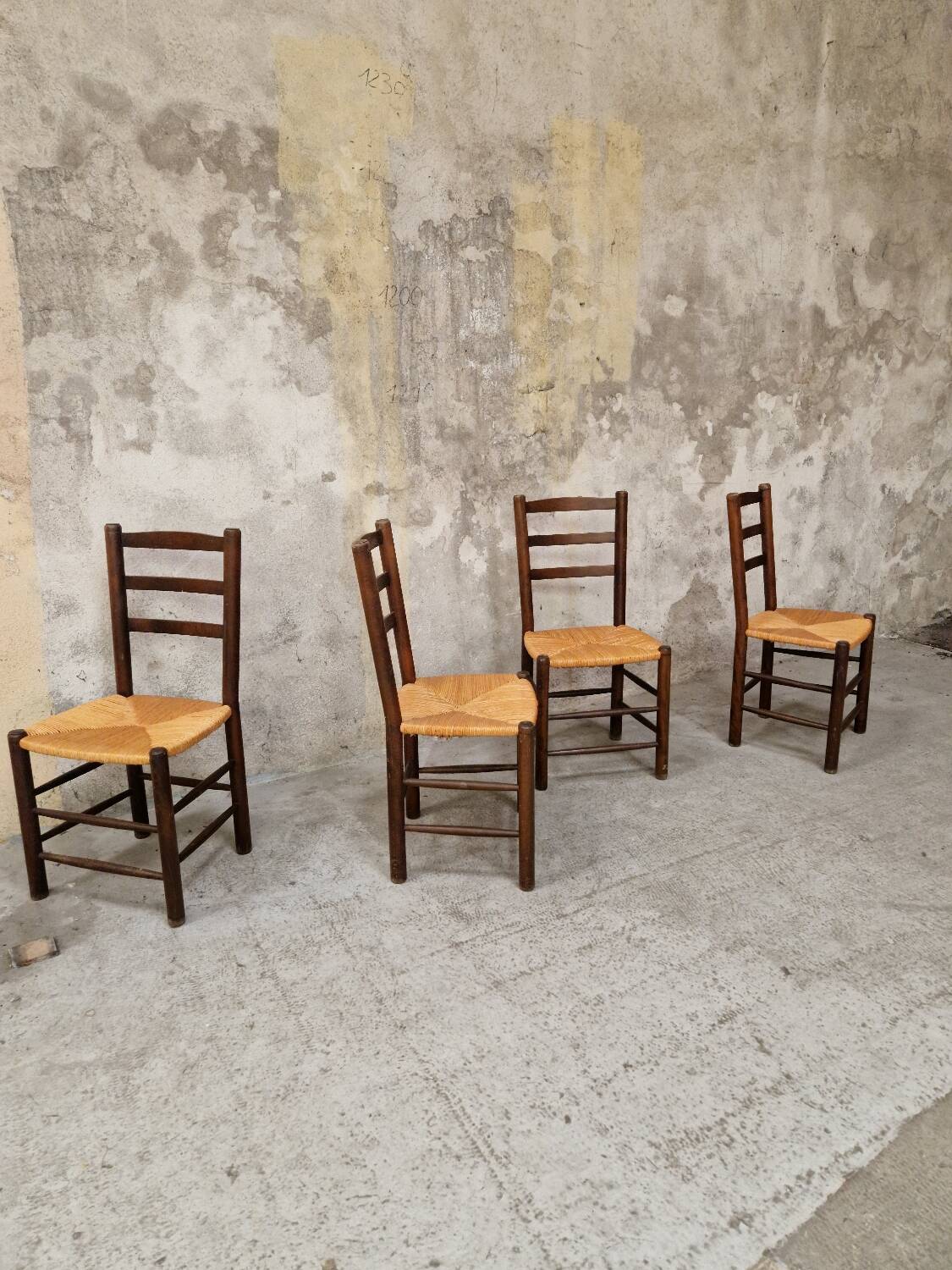 4 wooden and straw chairs