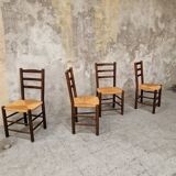 4 wooden and straw chairs