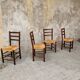 4 wooden and straw chairs
