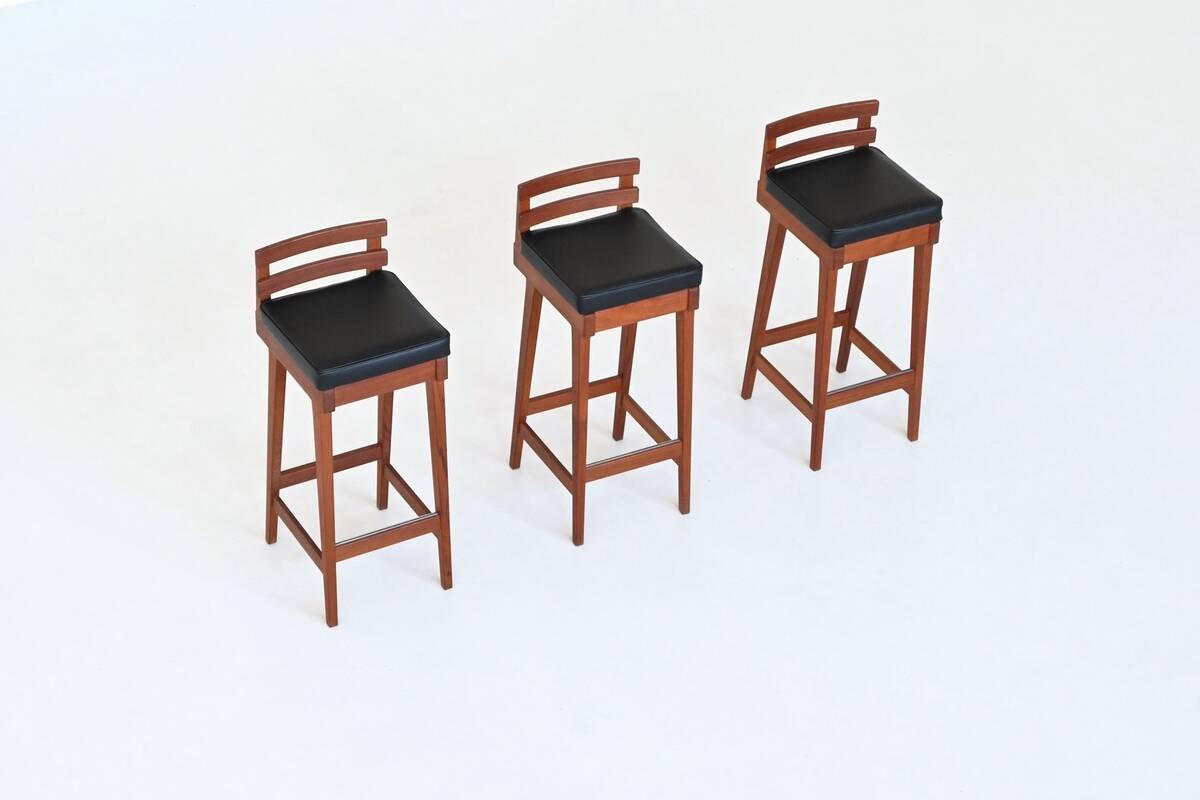 Erik Buck set of three bar stools in teak and leather Dyrlund Denmark 1960