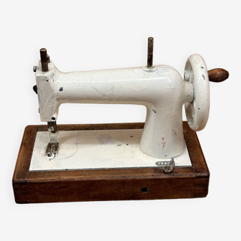 Small white sewing machine