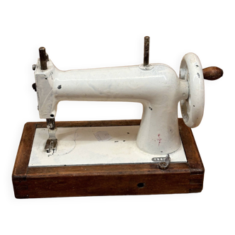 Small white sewing machine