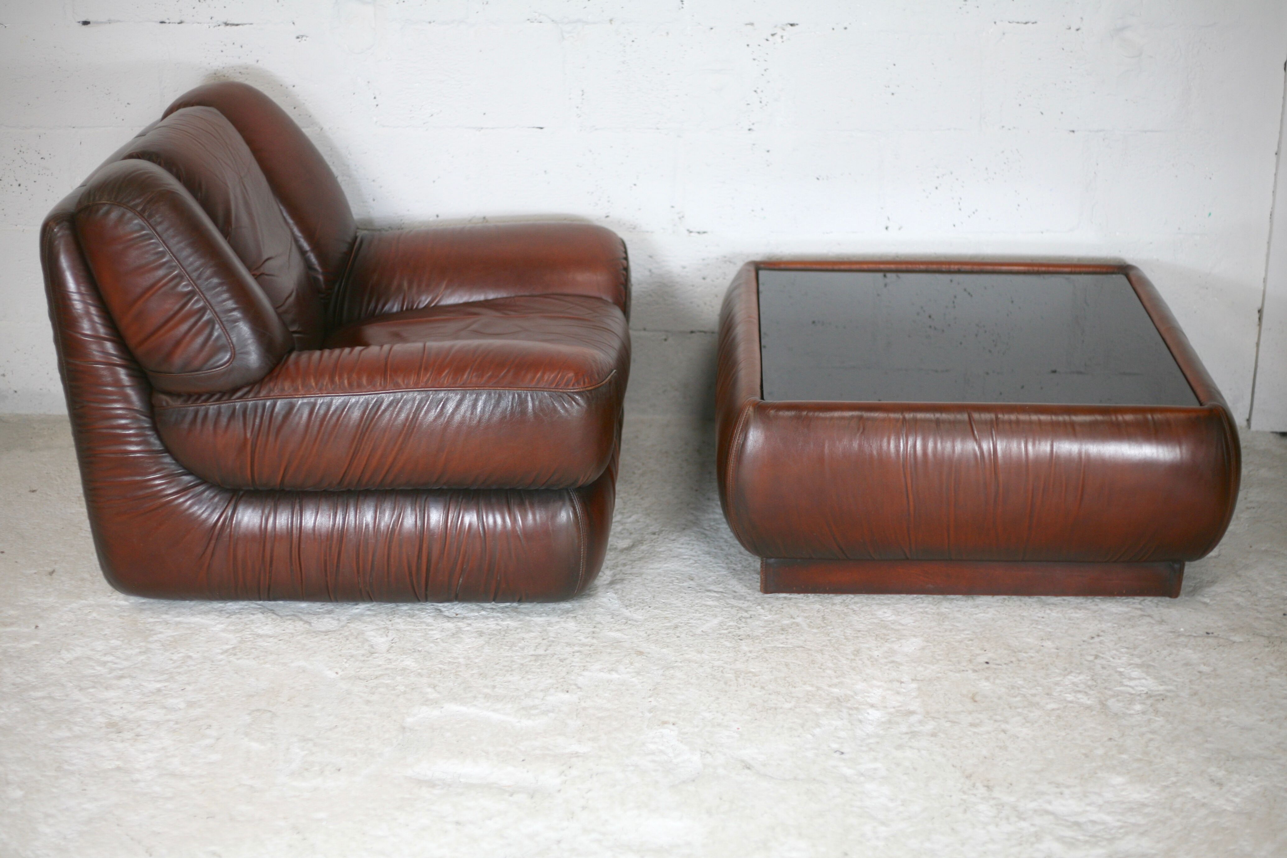 Leather armchair and coffee table set, Italy, circa 1970. Space Age